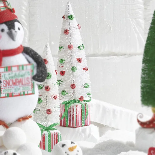 White Bottle Brush Tree with Ornaments on Present